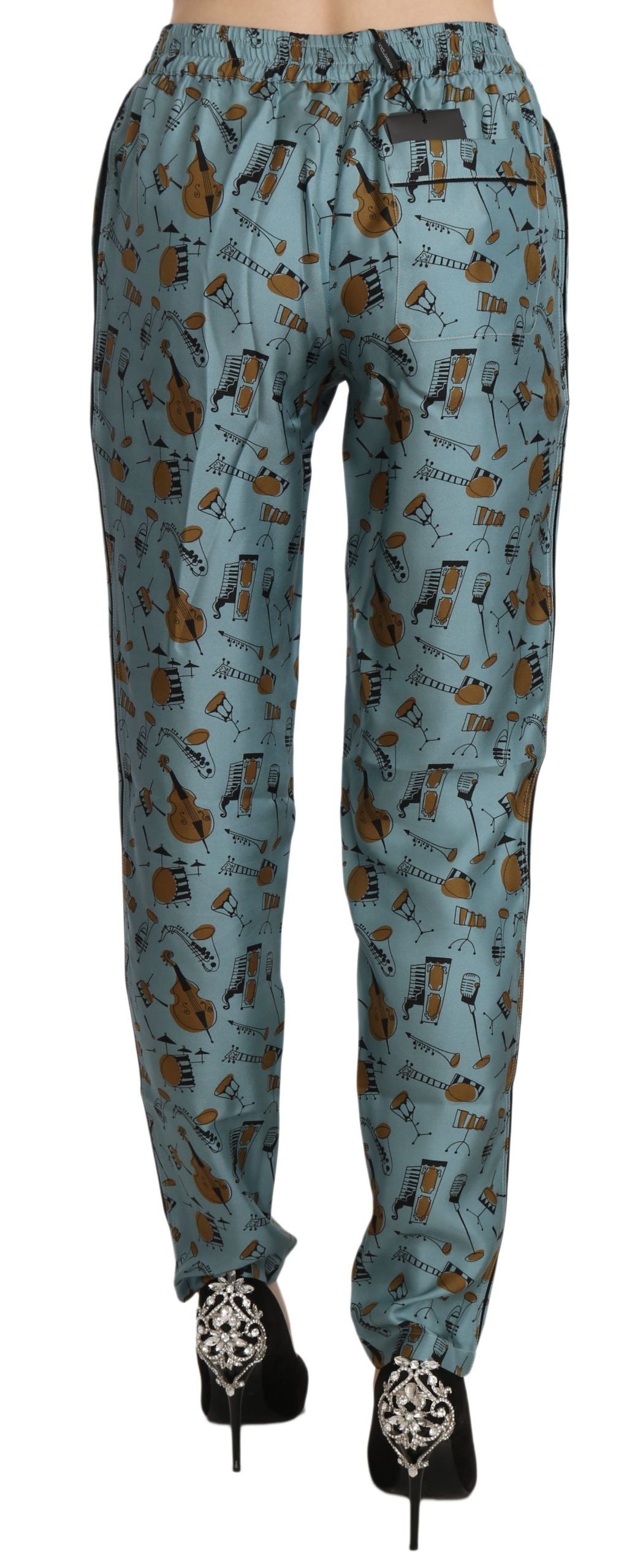 Blauwe muziekinstrumentenprint taps toelopende broek