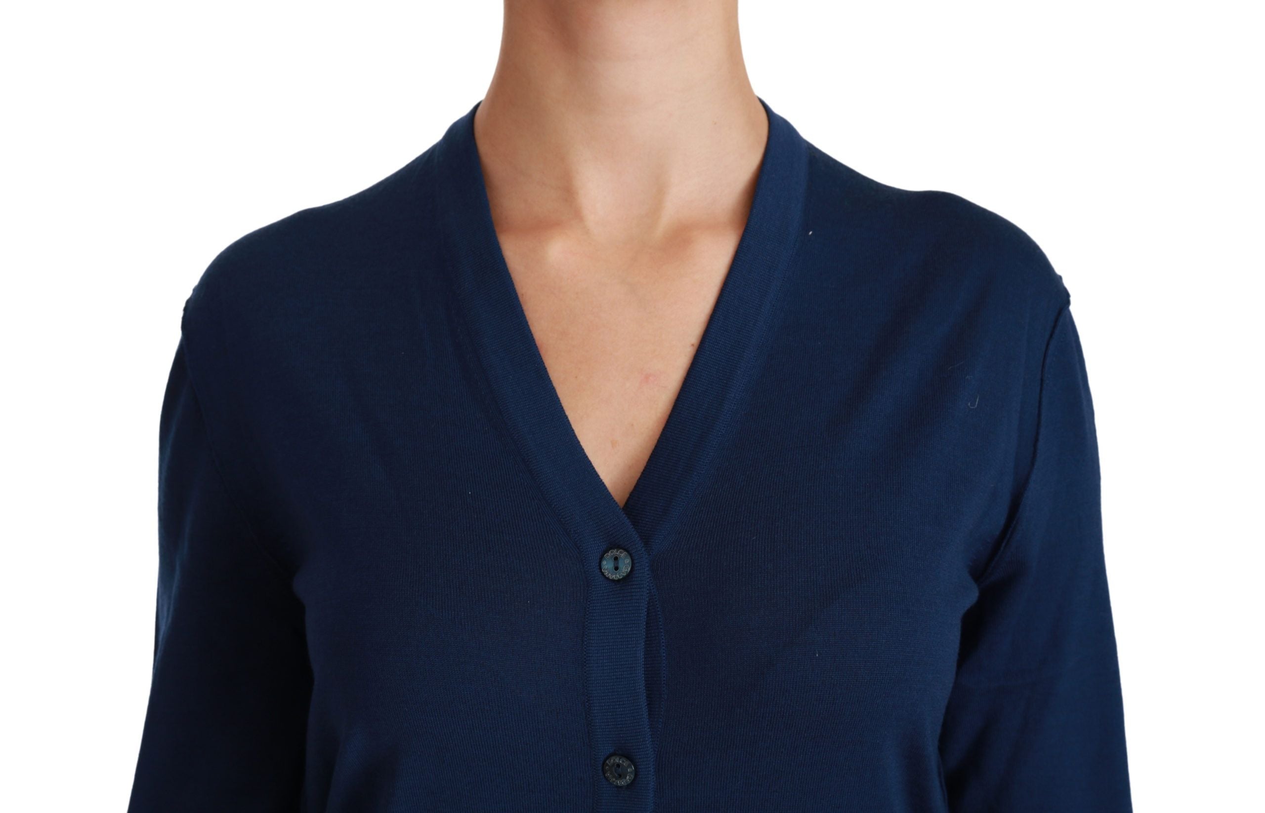 Blauwe knoopvest van maagdelijke wol