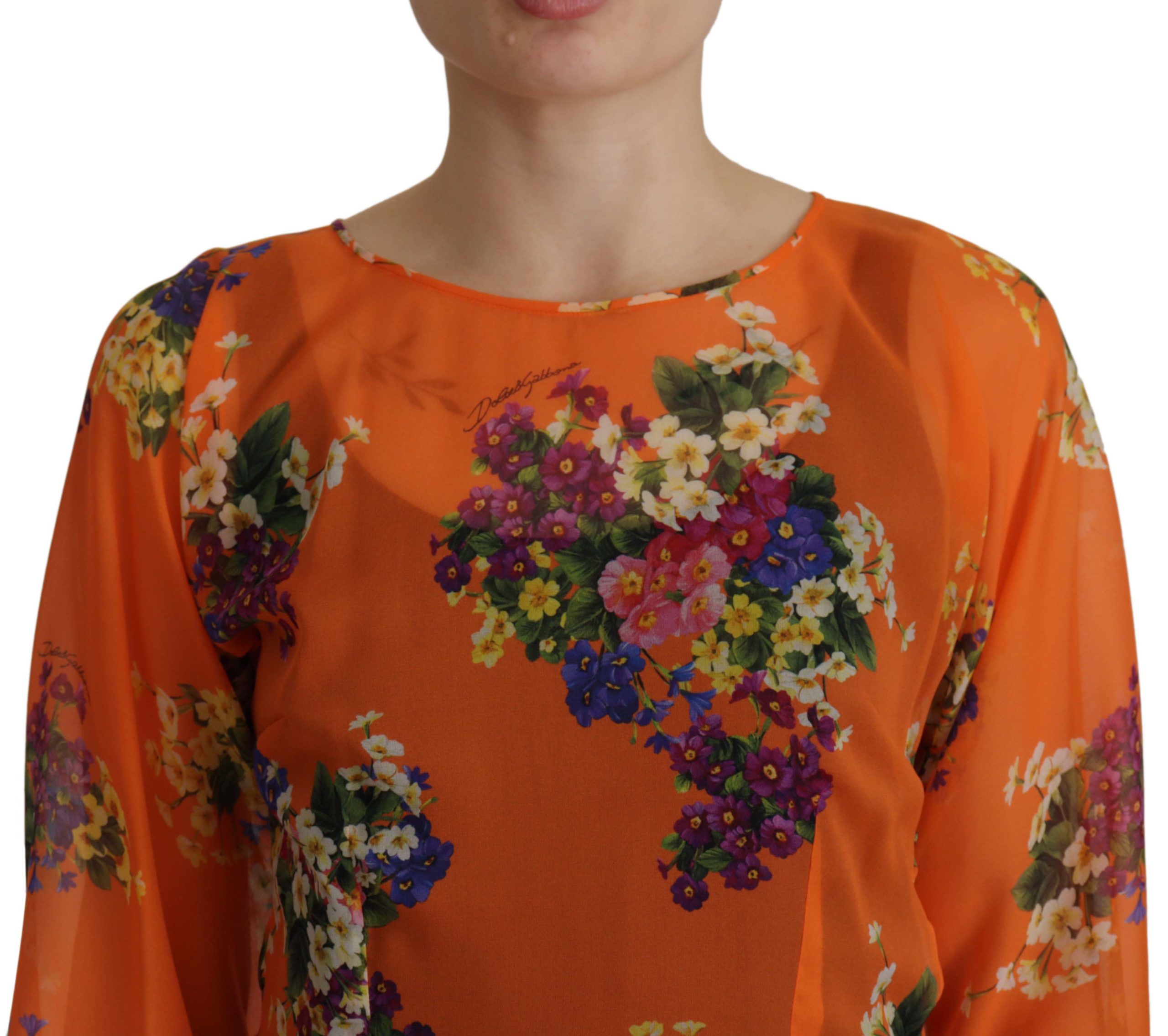 Oranje blouse met bloemenprint en lange mouwen