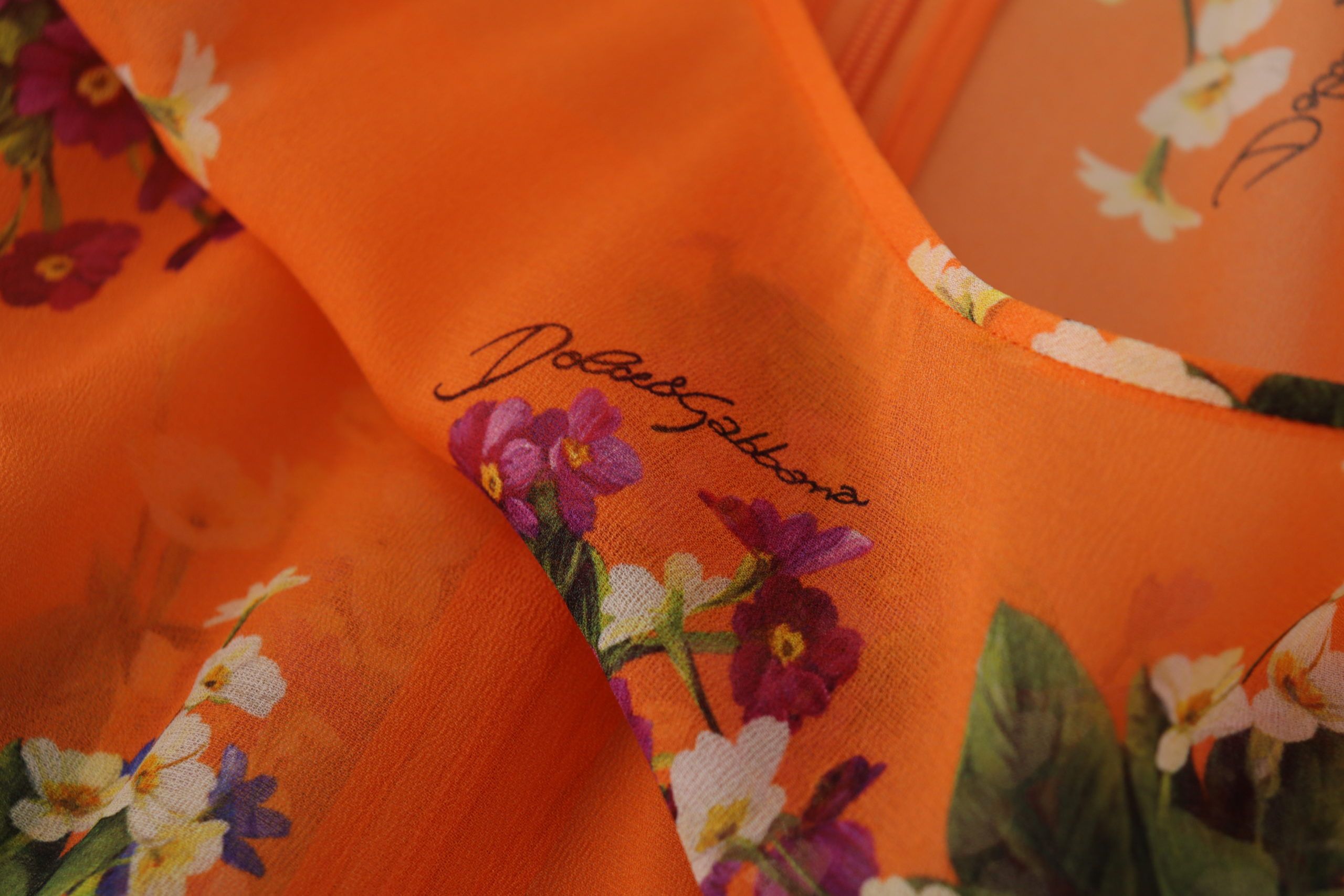 Oranje blouse met bloemenprint en lange mouwen