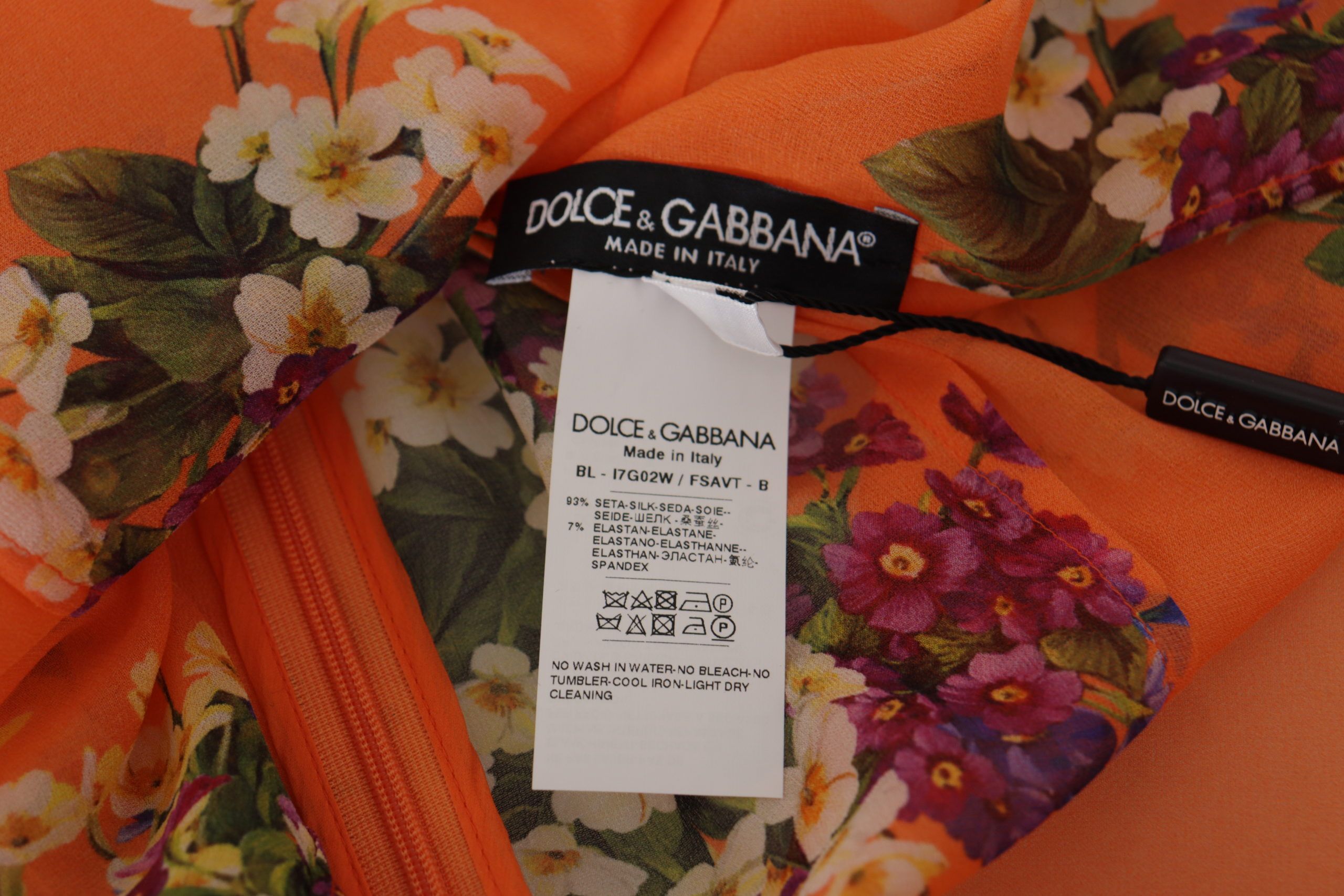 Oranje blouse met bloemenprint en lange mouwen
