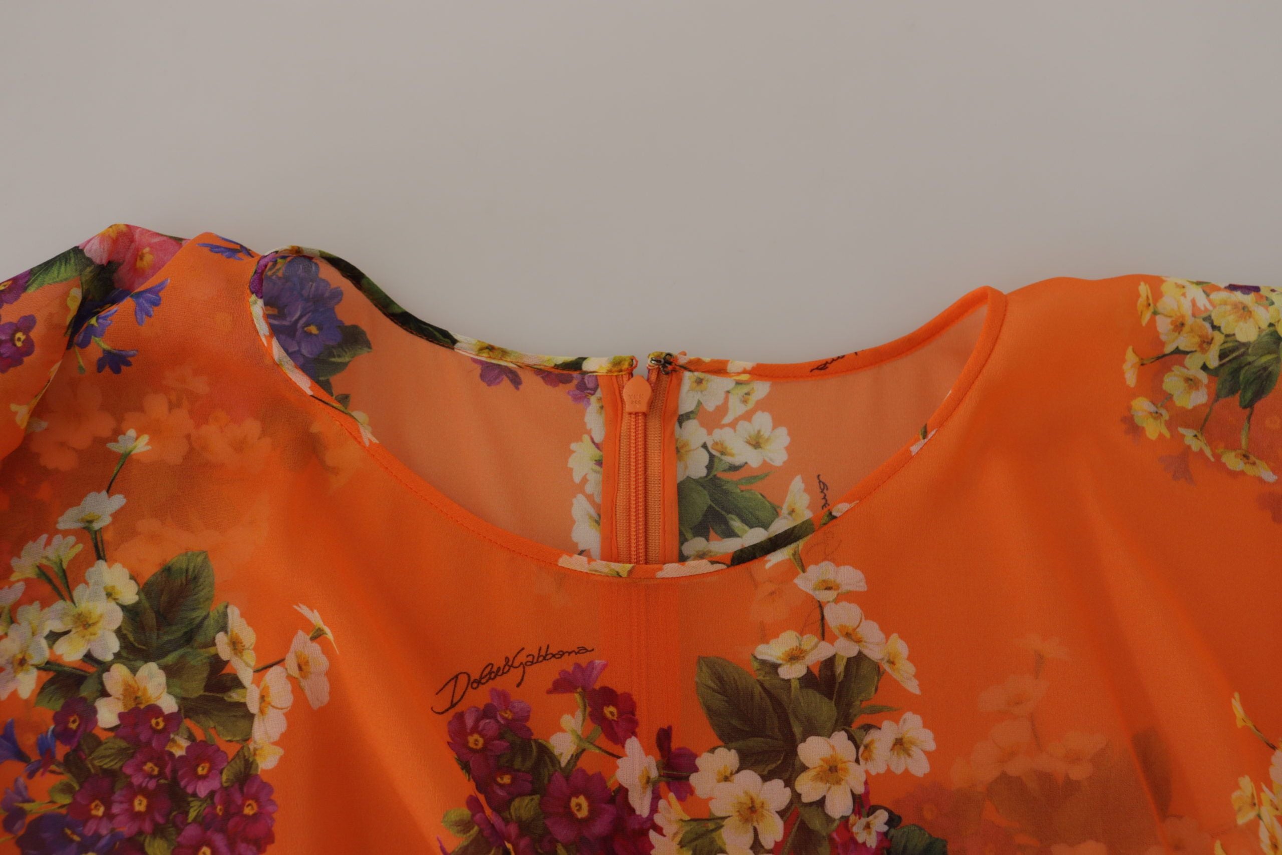 Oranje blouse met bloemenprint en lange mouwen