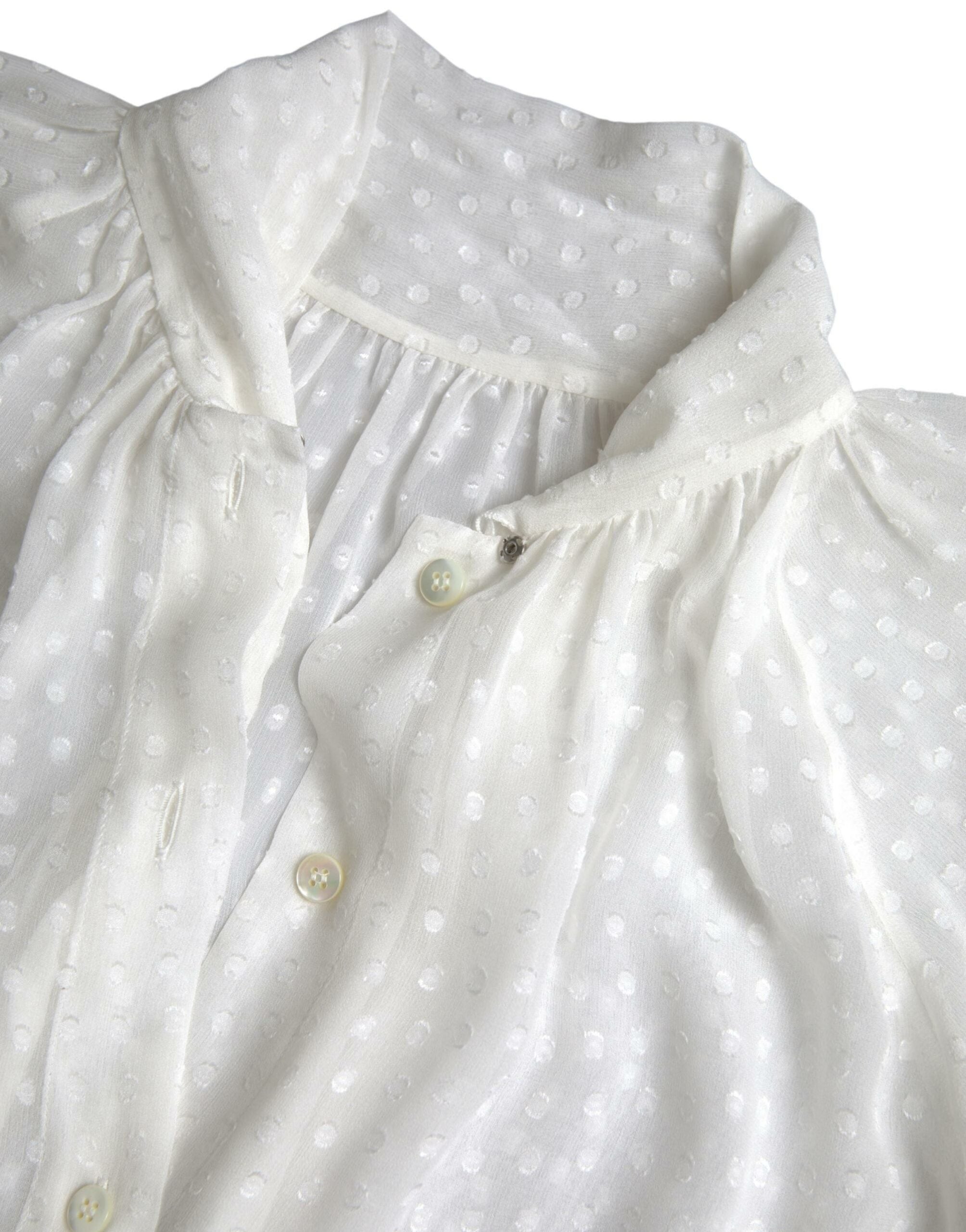Witte zijden blouse met doorschijnende hals en stippenmotief