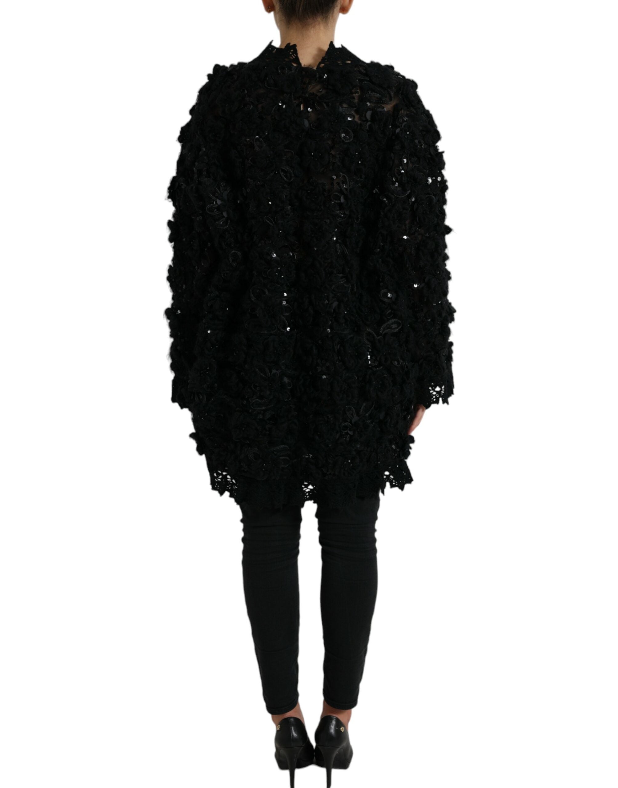 Zwarte met pailletten versierde pullover
