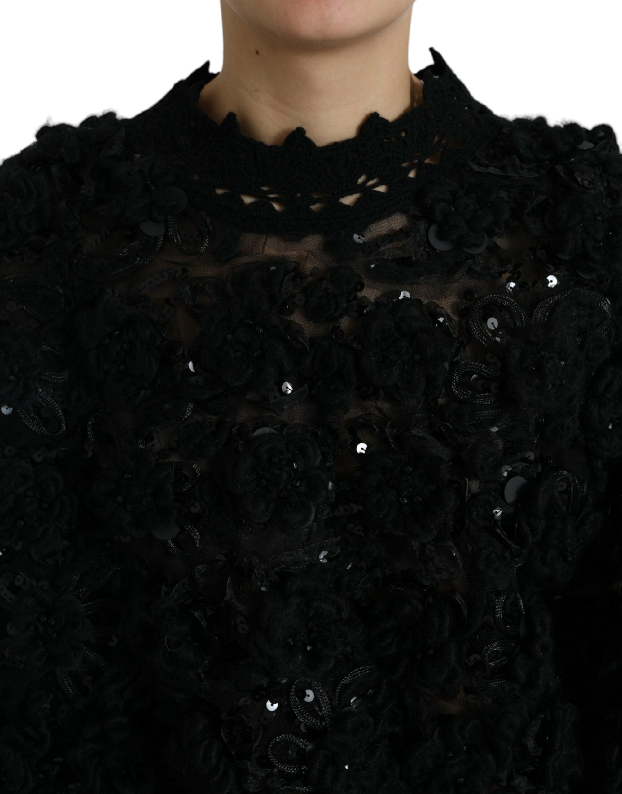 Zwarte met pailletten versierde pullover