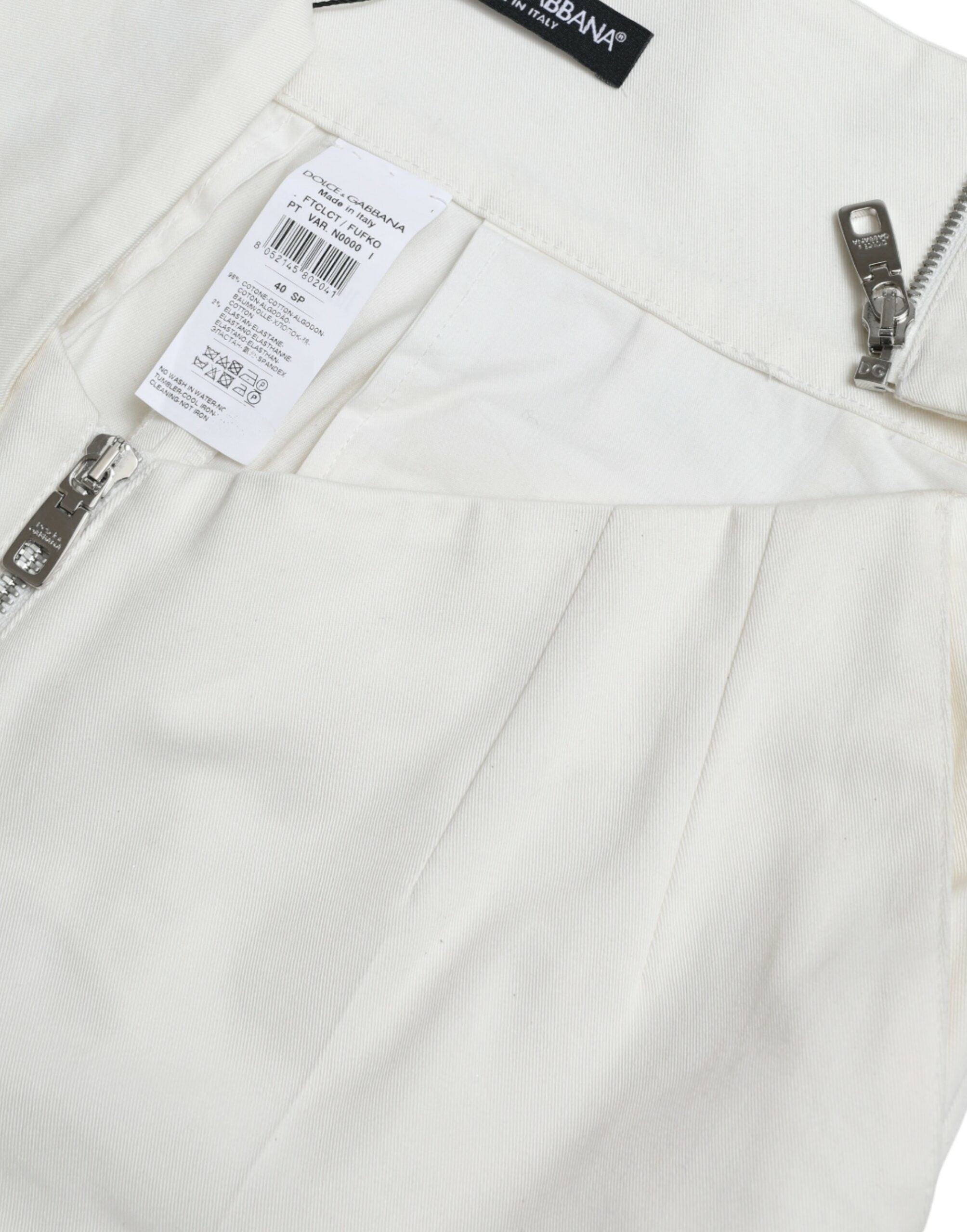 Zwarte witte katoenen broek met uitgesneden taille en taps toelopende pijpen