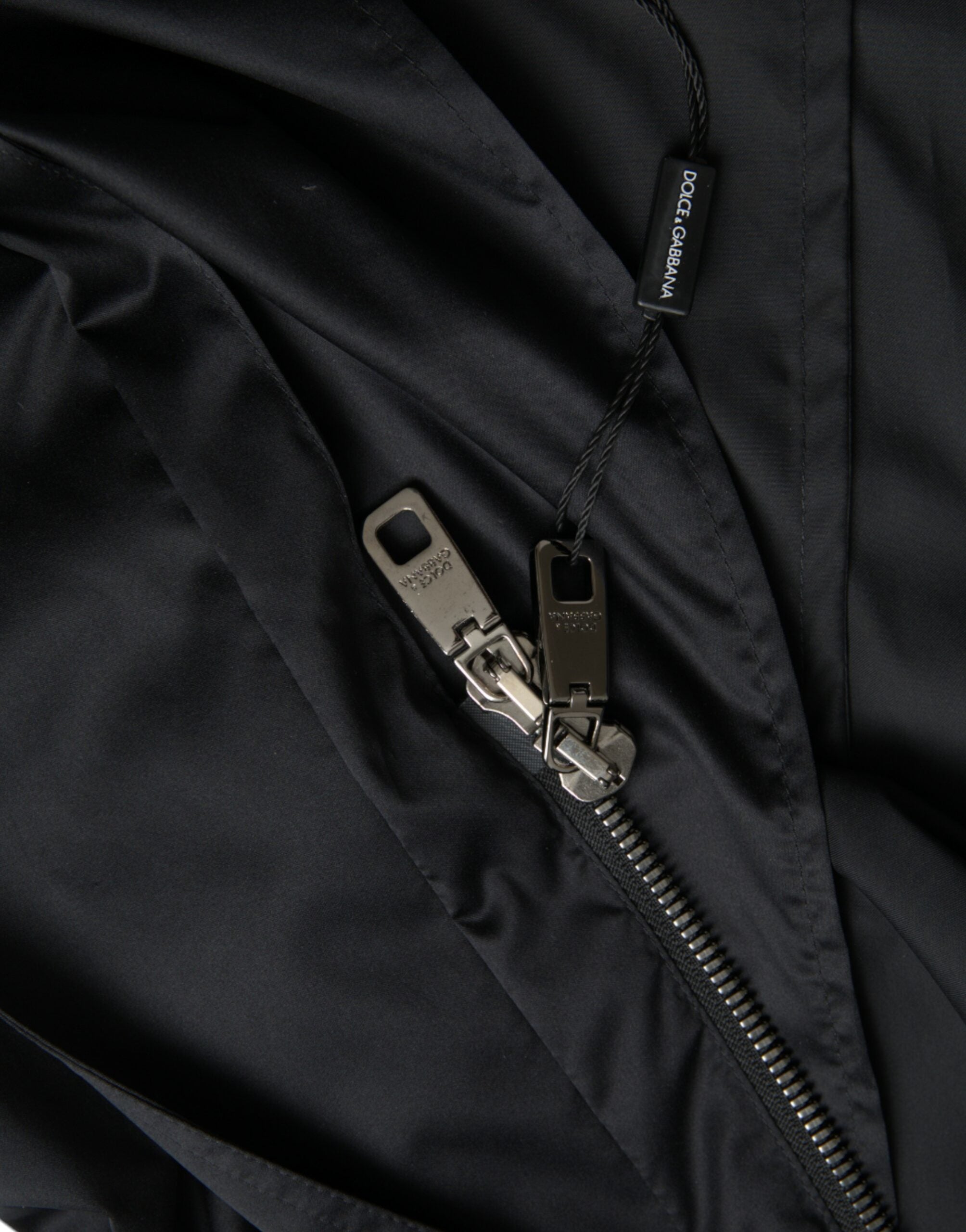 Zwarte polyester lange windjack met capuchon