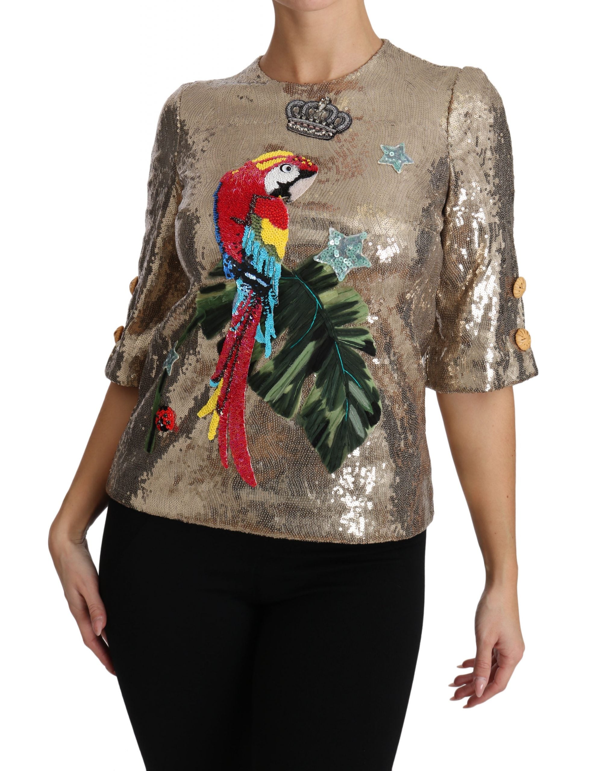 Goudkleurige blouse met pailletten en papegaaikristal