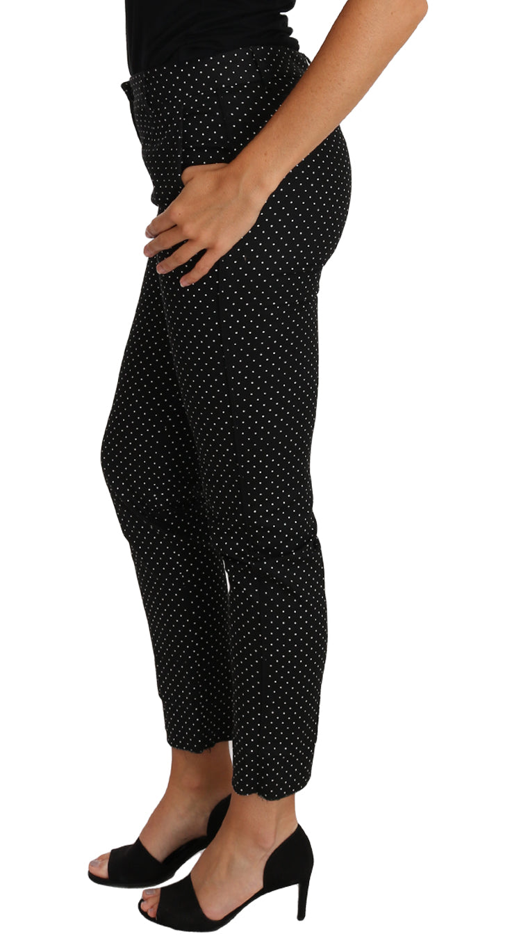 Zwarte jurk met stippen en rechte broek