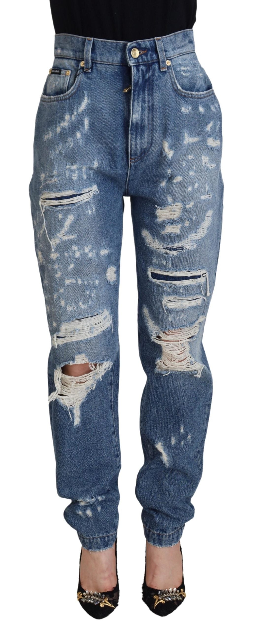 Blauwe gewassen katoenen gescheurde denim jeans