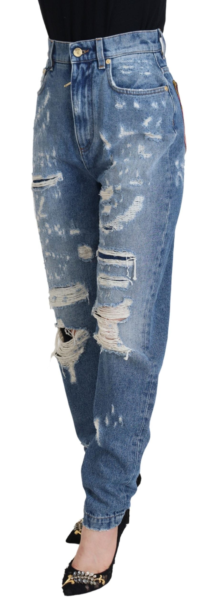 Blauwe gewassen katoenen gescheurde denim jeans