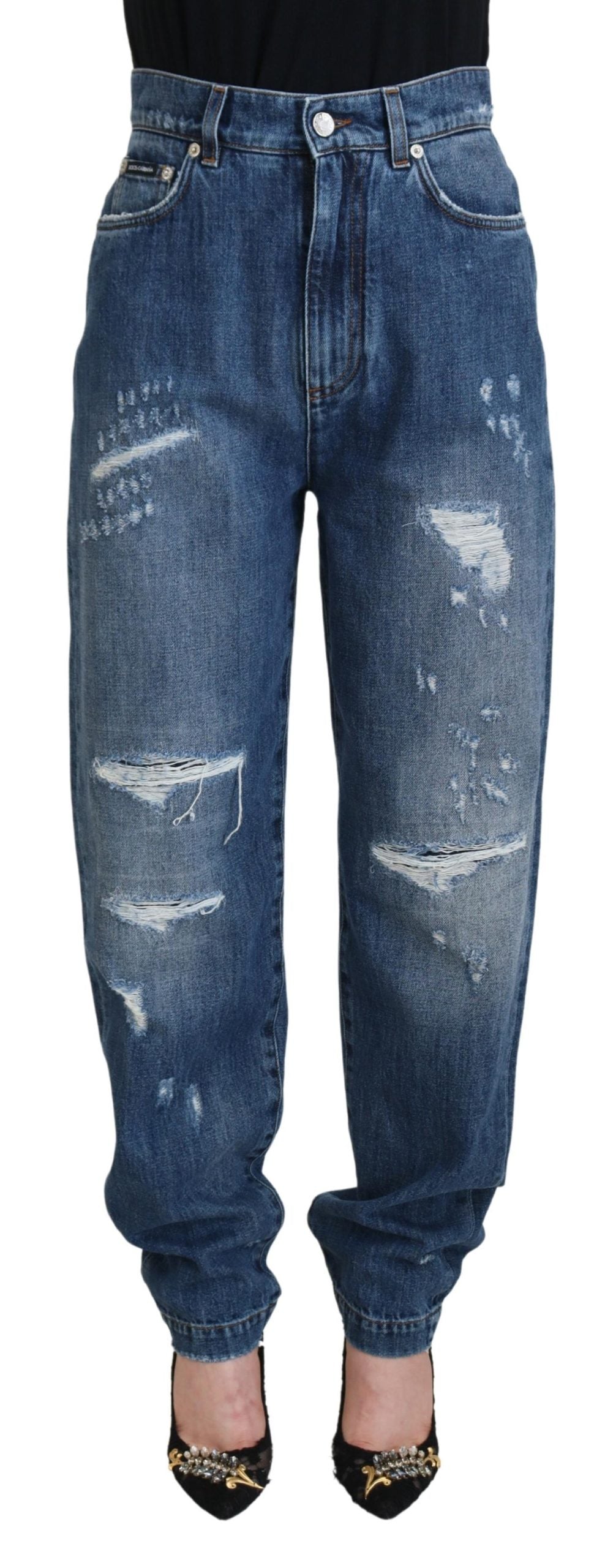 Blauwe gewassen katoenen gescheurde denim jeans