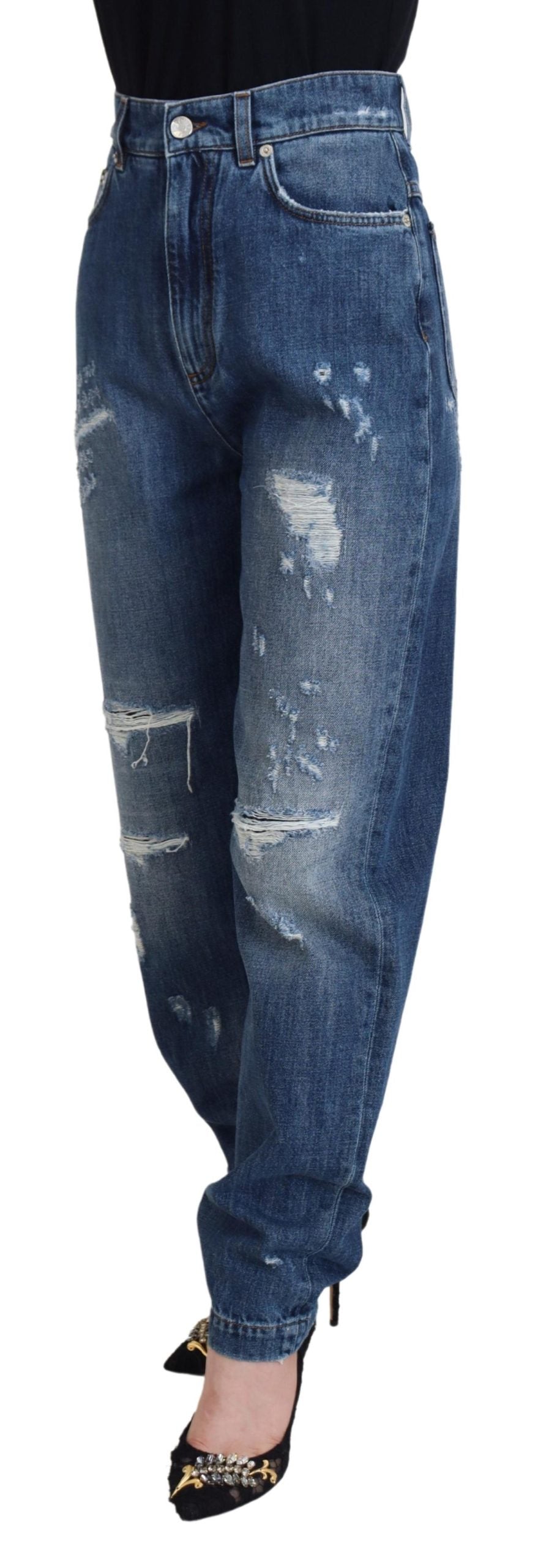Blauwe gewassen katoenen gescheurde denim jeans