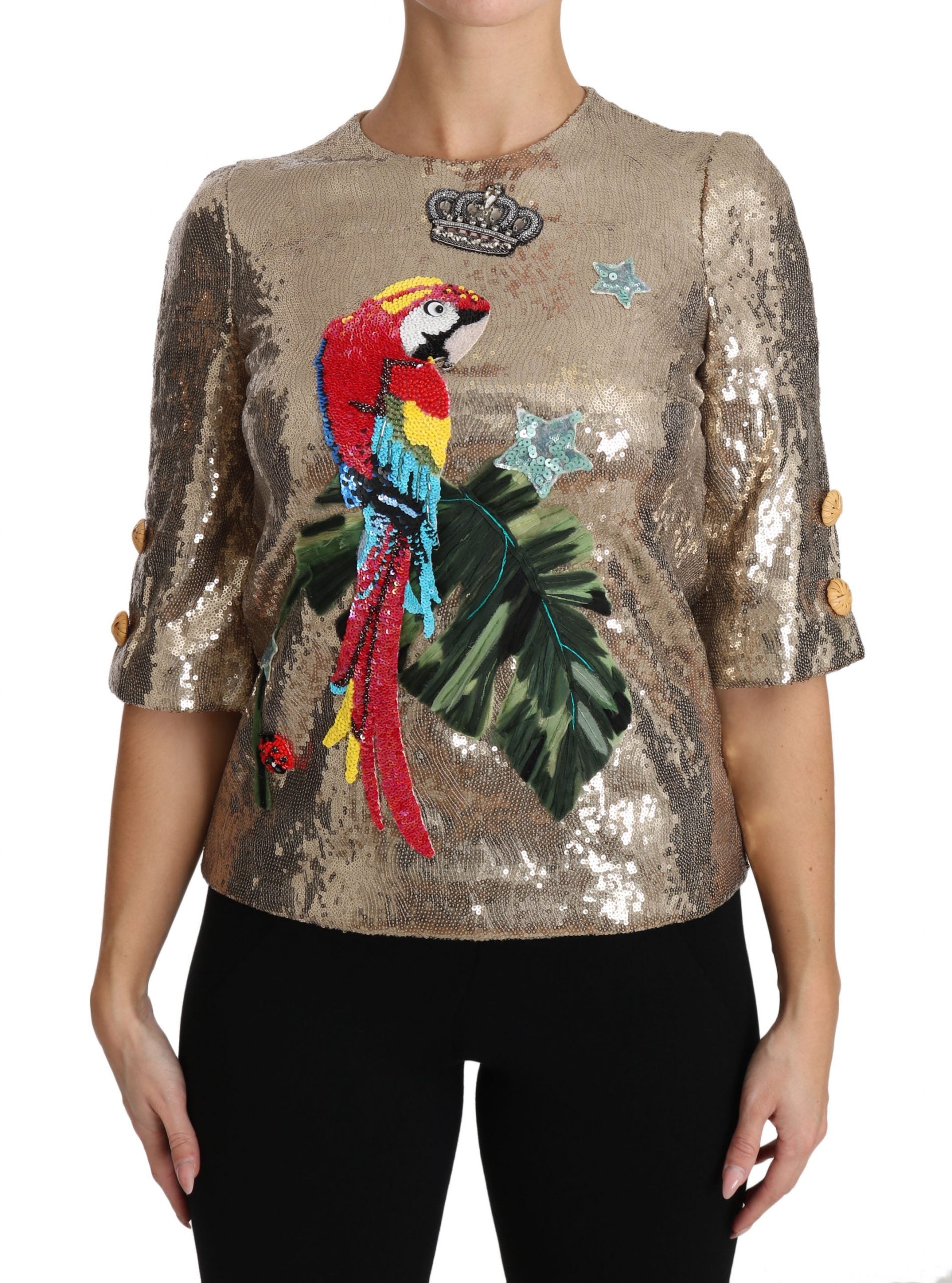 Goudkleurige blouse met pailletten en papegaaikristal